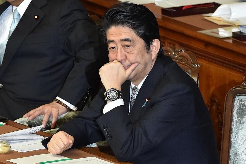 Japan's Prime Minister Shinzo Abe attends a session at the National Diet in Tokyo on Jan 26, 2015.&nbsp;The Japanese PM may leave out key descriptions of Japan's World War II conduct in a statement to be issued in August on the 70th anniversary of it