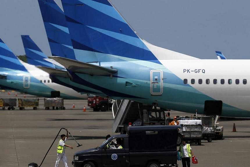 A Garuda Indonesia flight departing from Manokwari in West Papua to Jayapura in the eastern tip of Papua province was forced to make an emergency landing after its wing was damaged, likely by a lightning strike. -- PHOTO: REUTERS