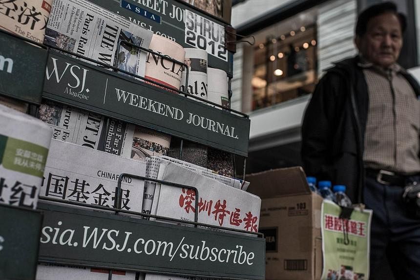 A report by the International Federation of Journalists warned on Monday, Jan 26, 2015, of "intervention behind the scenes" of Hong Kong's media as fears grow over press freedoms and interference from Beijing. -- PHOTO: AFP