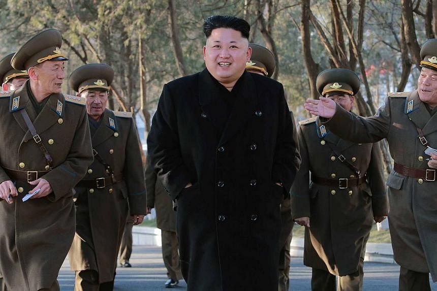 This undated picture released by North Korea's official Korean Central News Agency (KCNA) on Jan 13, 2015 shows North Korean leader Kim Jong Un (centre) during an inspection of the Air and Anti-Air Force of the Korean People's Army (KPA) command in N