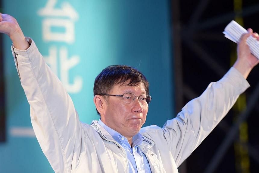 Newly-elected independent Taipei Mayor Ko Wen-je gestures after winning the mayor elections in Taipei on Nov 29, 2014.&nbsp;Mr Ko and British transport minister Baroness Susan Kramer committed a double gaffe on Monday, Jan 26, 2015, after she present