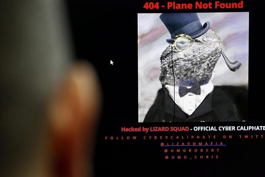 A computer user looks at a screen displaying the official Malaysia Airlines website as it has been hacked, in Bangkok, Thailand on Jan 26, 2015.&nbsp;-- PHOTO: EPA
