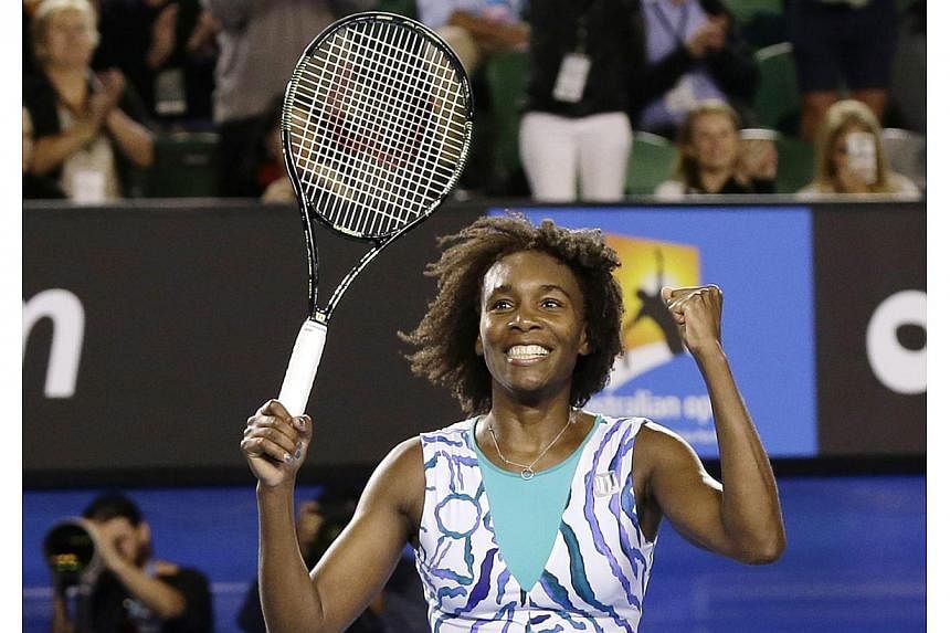 Venus Williams of the US jubilates after winning against Agnieszka Radwanska of Poland in their fourth round match at the Australian Open Grand Slam tennis tournament in Melbourne, Australia on Jan 26, 2015. -- PHOTO: EPA