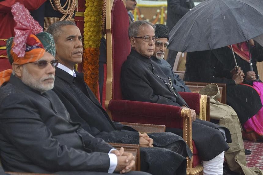 (From left to right) India's Prime Minister Narendra Modi, US President Barack Obama, India's President Pranab Mukherjee and Vice President Mohammad Hamid Ansari attending the Republic Day parade in New Delhi on Jan 26, 2015.&nbsp;-- PHOTO: REUTERS