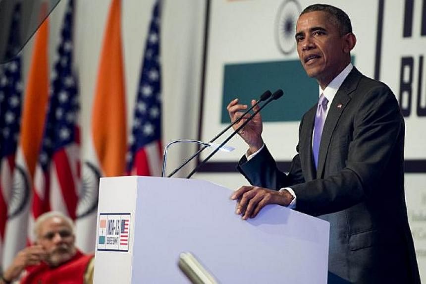 US President Barack Obama speaks alongside Indian Prime Minister Narendra Modi (left) during the India-US Business Summit in New Delhi on Jan 26, 2015.&nbsp;-- PHOTO: AFP