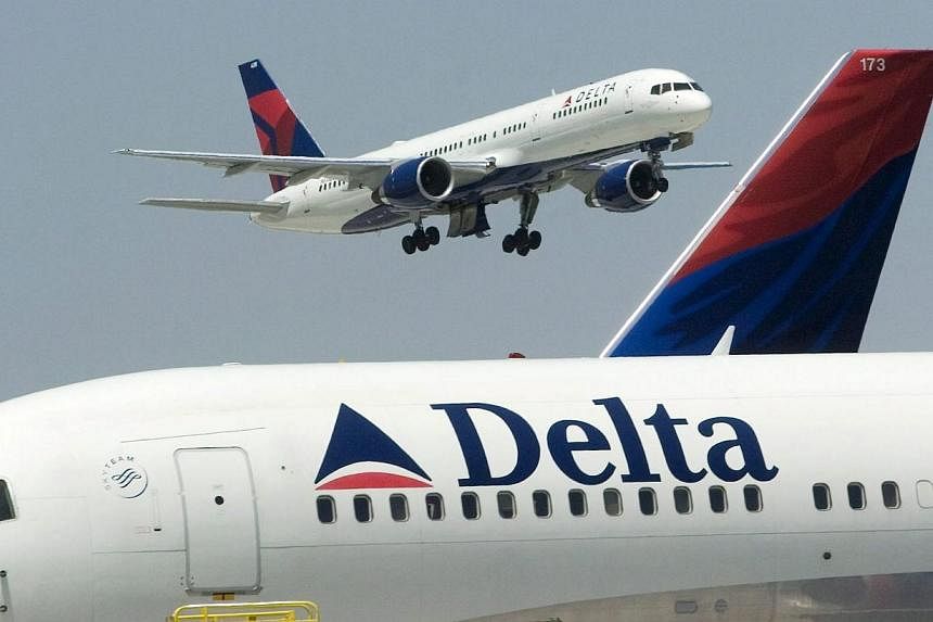 Delta has cancelled about six regional flights into New York for Sunday, the spokesman added. -- PHOTO: EPA