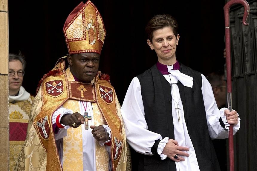 Bishop Libby Lane (R) leaves with Archbishop of York, John Sentamu, the York Minster in York, northern England, on January 26, 2015, after being consecrated as the new Bishop of Stockport. - PHOTO: AFP