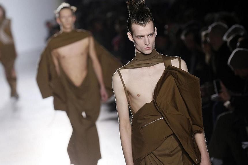 A model presents a creation by US fashion designer Rick Owens during the men's Fall/Winter 2015 ready-to-wear collection fashion show in Paris that ended Sunday. -- PHOTO: AFP