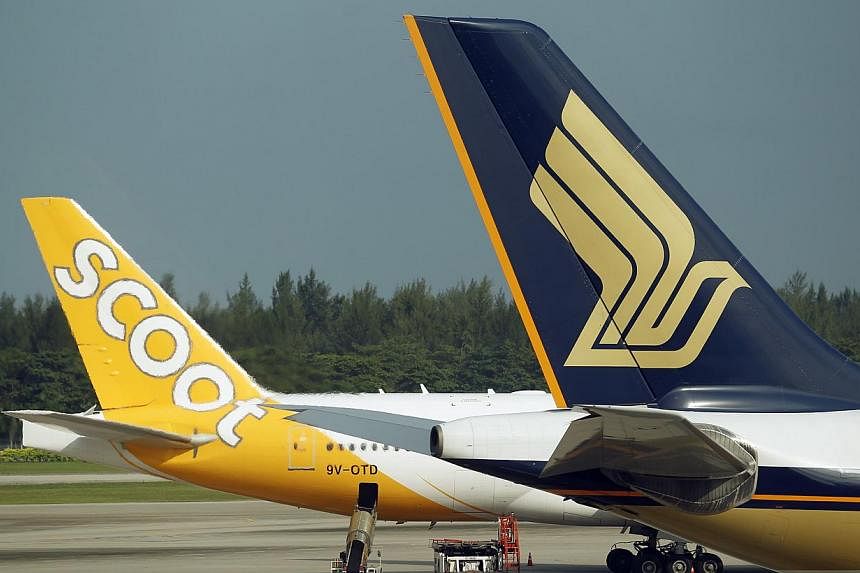 Singapore Airlines (SIA) frequent flyers can use their miles to redeem flights on Scoot and Tigerair from April. KrisFlyer members will also be able to collect miles when flying on the two other carriers starting later this year. -- ST PHOTO:&nbsp;LI