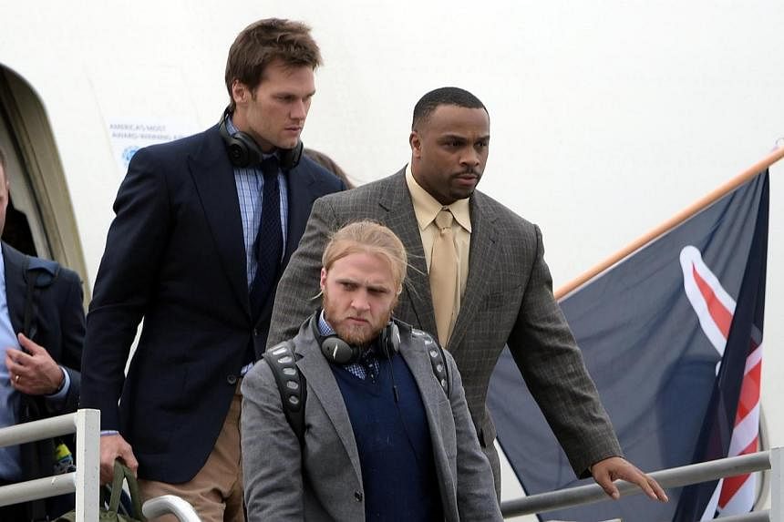 New England Patriots quarterback Tom Brady (second from right) arriving at Sky Harbor Airport in preparation for Super Bowl XLIX against the Seattle Seahawks.&nbsp;The Patriots escaped a winter blizzard to make their way to the Super Bowl city of Pho