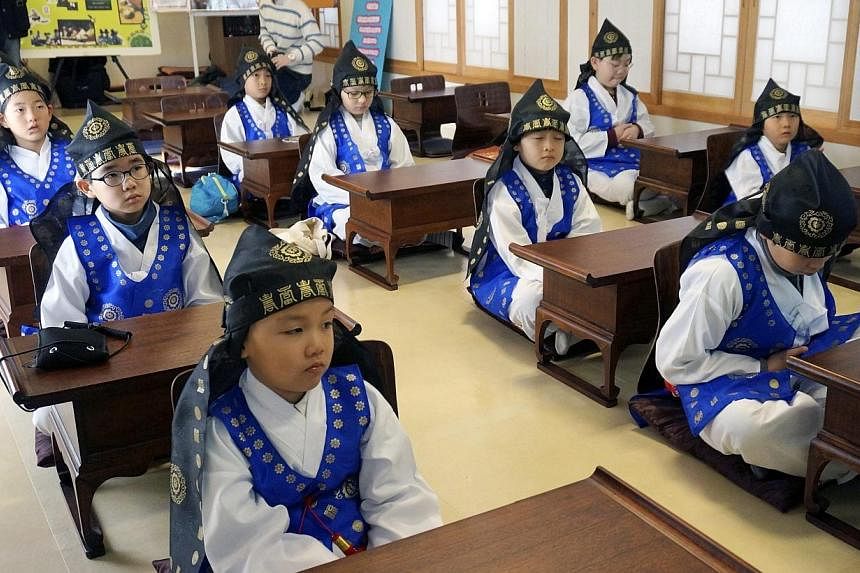 Children attend class at a 'Seodang', or traditional Korean school, in Seoul, South Korea, on Jan 13 2015.&nbsp;The government vowed on Tuesday to introduce a national qualification examination for workers at daycare centres for children amid rising 