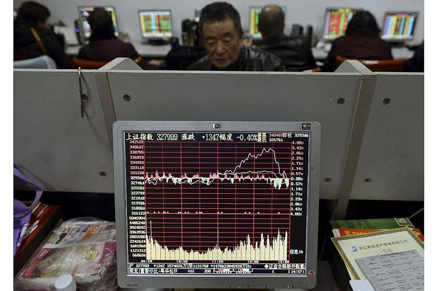 Investors looking at computer screens showing stock information at a brokerage house in Hangzhou, Zhejiang province, on Jan 9, 2015..&nbsp;After a two-day decline spurred by regulatory efforts on Jan 16 to curb margin lending by some of China's bigge