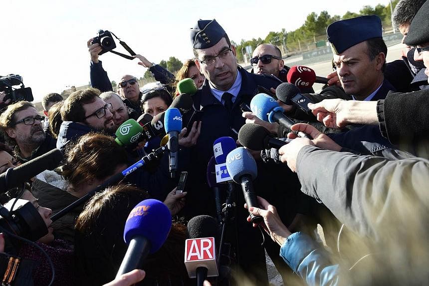 Captain Jose Guerreira speaks to the press outside the entrance to Los Llanos military base in Albacete on Jan 27, 2015, after a Greek fighter jet crashed on takeoff at the military base housing a Nato training centre for elite pilots. -- PHOTO: AFP