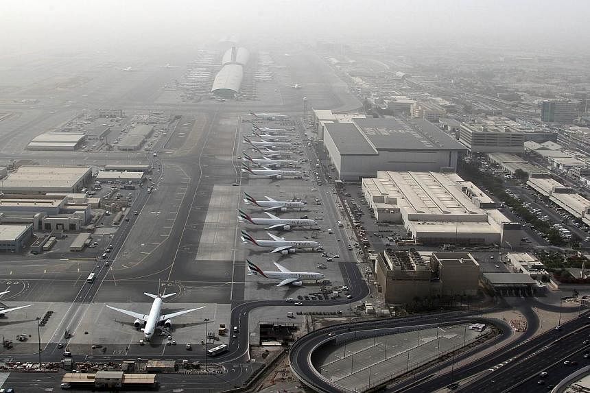 A file picture taken on May 27, 2012, an aerial view shows Dubai international airport, home to the national carrier Emirates Airways. -- PHOTO: AFP