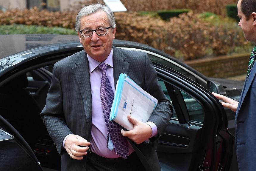 European Commission President Jean-Claude Juncker arrives to attend a Eurogroup finance ministers meeting at the European Council in Brussels, on Jan 26, 2015. -- PHOTO: AFP