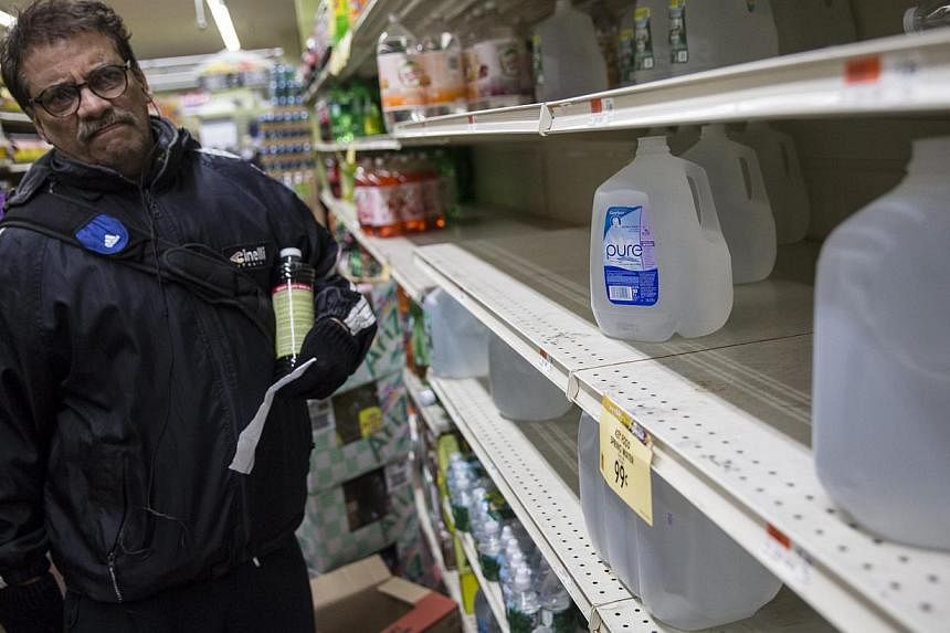 A man shopping for water in preparation for a large winter storm in New York, New York on Jan 26, 2015. -- PHOTO: EPA