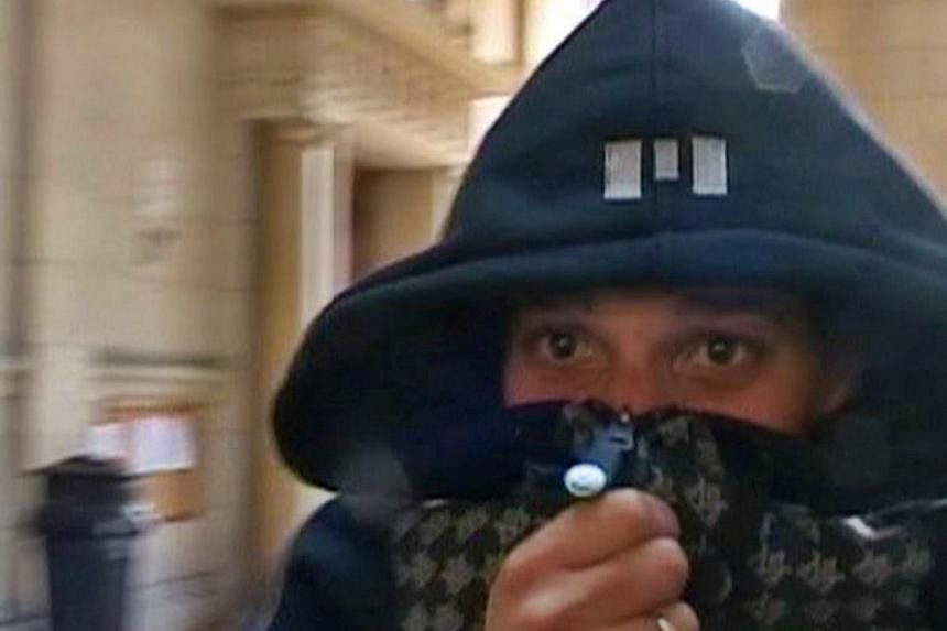 A man identified by a lawyer as Cherif Kouachi, one of the two brothers who killed 12 people in the attack on the weekly paper Charlie Hebdo in Paris, is seen in this still image taken from Reuters TV video shot in March 2008 at a Paris courthouse wh
