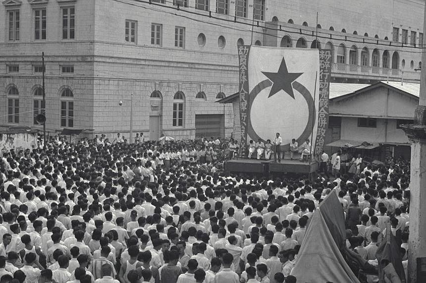 A Barisan Socialis rally held at Colombo Court on Dec 10, 1961. The Barisan Socialis was formed when 13 People's Action Party assemblymen were expelled from the party and went on to form their own political party in 1961. -- PHOTO: ST FILE