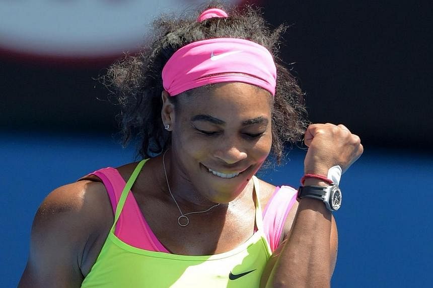 Serena Williams of the US celebrates after victory in her women's singles match against Slovakia's Dominika Cibulkova on day ten of the 2015 Australian Open tennis tournament in Melbourne on Jan 28, 2015. -- PHOTO: AFP