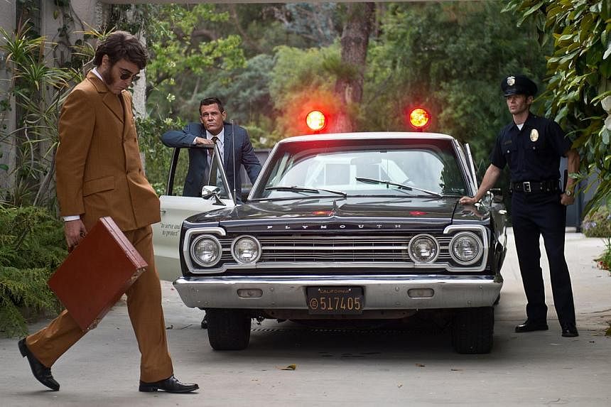 Private eye Joaquin Phoenix (left) crosses paths with detective Bjornsen (Josh Brolin, centre). -- PHOTO: WARNER BROS