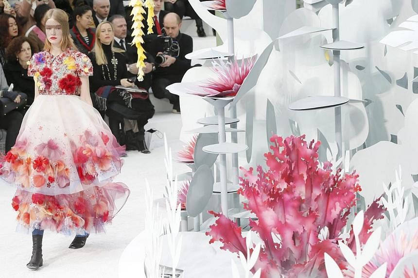 A model presents a creation by German designer Karl Lagerfeld as part of his Haute Couture Spring Summer 2015 fashion show for French fashion house Chanel in Paris on Jan 27, 2015. -- PHOTO: REUTERS