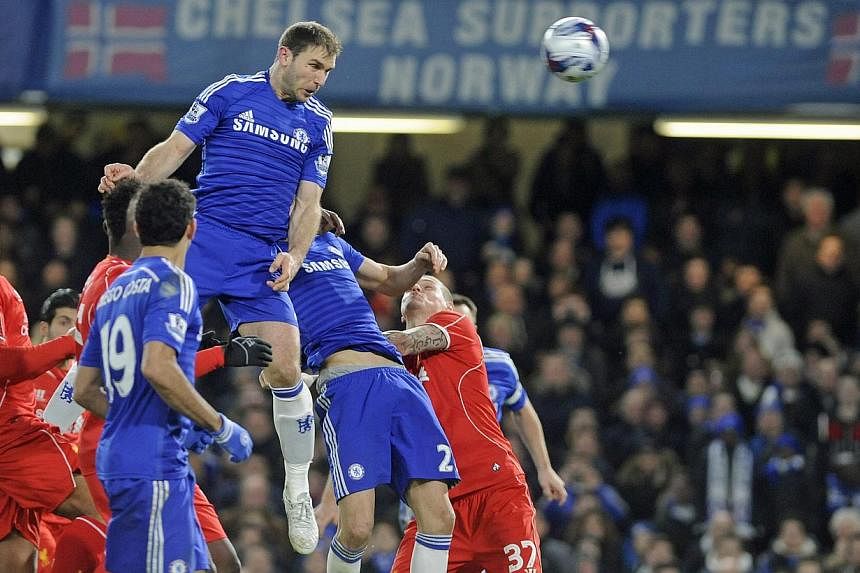 Chelsea's Branislav Ivanovic scoring the 1-0 in extra time during the English Capital One Cup semi-final football match return leg between Chelsea FC and Liverpool FC at Stamford Bridge in London, Britain, on Jan 27, 2015. -- PHOTO: EPA
