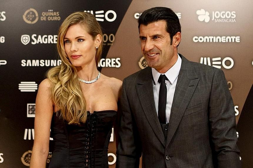 Former Portuguese footballer Luis Figo (right) and wife, Swedish model Helen Svedin, arriving at the casino of Estoril for the Quinas de Ouro gala, in Estoril, Portugal, on Jan 14, 2015. &nbsp;-- PHOTO: EPA