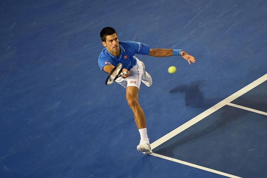 Serbia's Novak Djokovic plays a shot during his men's singles match against Canada's Milos Raonic on day ten of the 2015 Australian Open tennis tournament in Melbourne on Jan 28, 2015. -- PHOTO: AFP