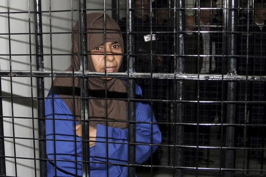 Iraqi Sajida al-Rishawi stands inside a military court at Juwaida prison in Amman in this April 24, 2006 file photo.&nbsp;The Islamic State in Iraq and Syria (ISIS) group's demand that a militant on Jordan's death row be exchanged for a Japanese host