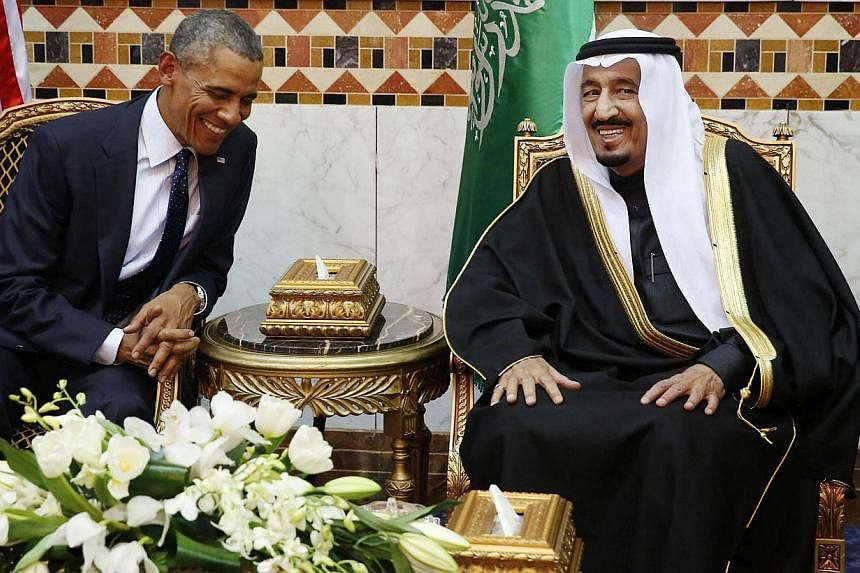 US President Barack Obama meeting Saudi Arabia's King Salman (right) at Erga Palace in Riyadh, Jan 27, 2015. -- PHOTO: REUTERS