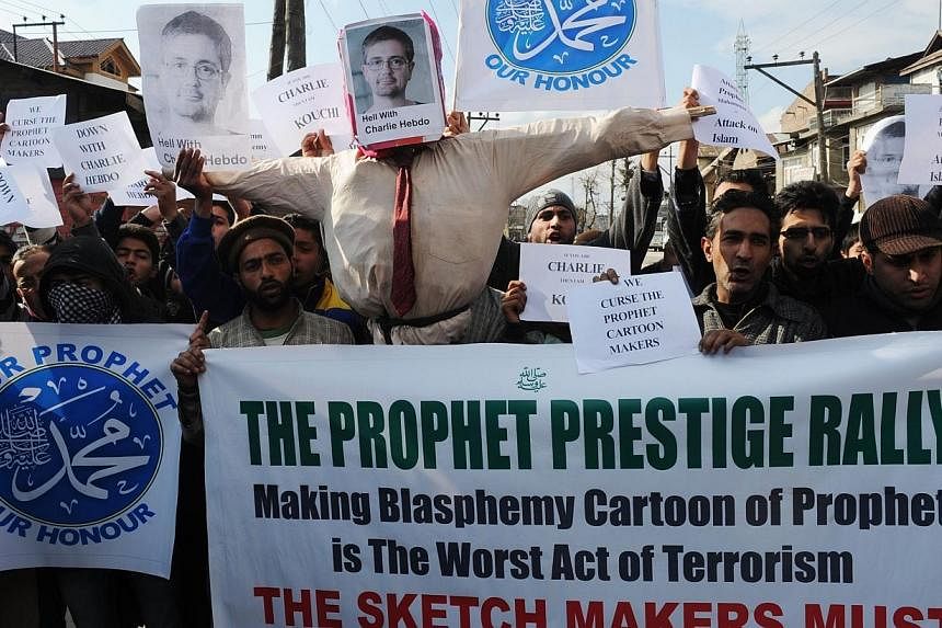 Kashmiri Muslims demonstrating against French magazine Charlie Hebdo during a protest in Srinagar, India on Jan, 23, 2015.&nbsp;Police have arrested and bailed the editor of an Urdu-language newspaper in Mumbai for reprinting a cartoon of the Prophet