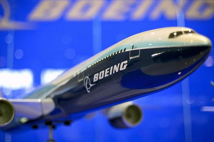 US aerospace giant Boeing Wednesday reported higher quarterly profits and forecast another increase in commercial plane deliveries in 2015 thanks to strong demand from airlines. -- PHOTO: EPA