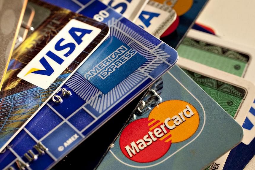 American Express, MasterCard and Visa credit cards are being displayed in New York, US, on May 18, 2010. -- PHOTO: BLOOMBERG&nbsp;