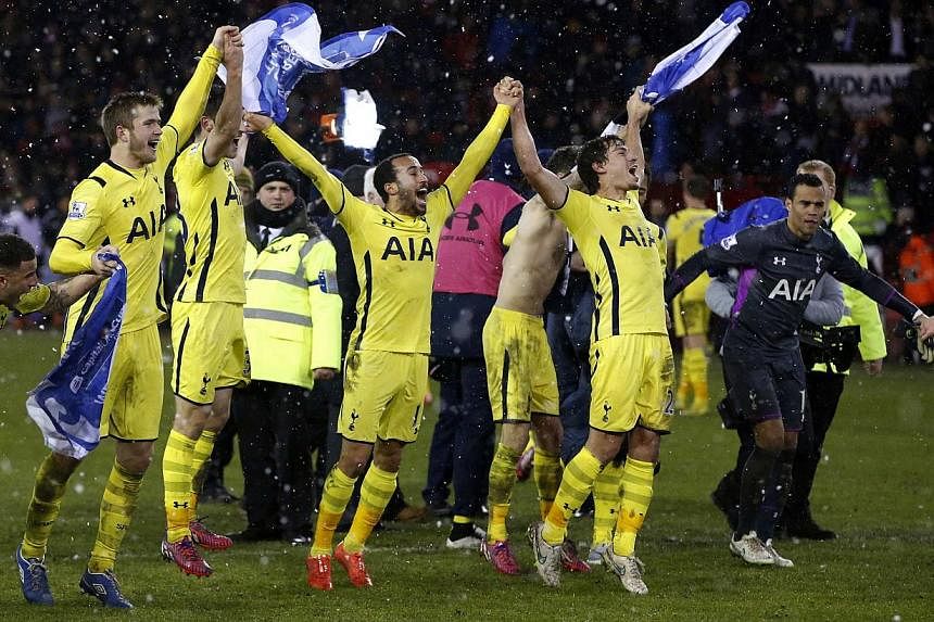 Tottenham Hotspur's players celebrating after their League Cup semi-final win against Sheffield United at Bramall Lane in Sheffield, on Jan 28, 2015. -- PHOTO: REUTERS