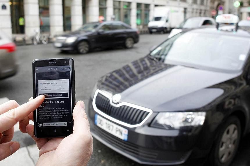 A picture shows the Uber smartphone app, used to book taxis using its service&nbsp;on Dec 10, 2014 in Paris. -- PHOTO: AFP