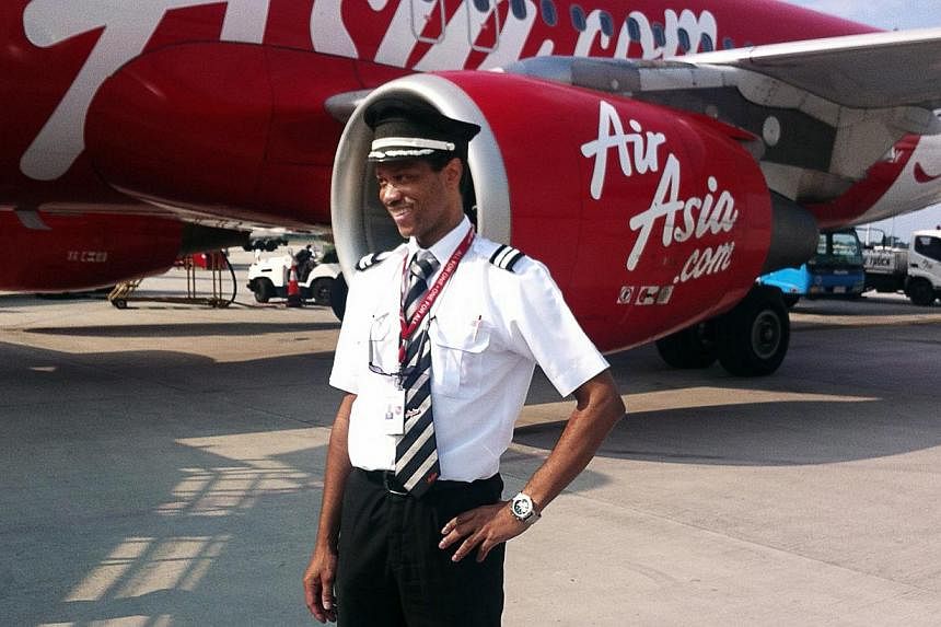 A 2013 photo provided by the Plesel family shows the co-pilot of AirAsia flight QZ8501, Remi Emmanuel Plesel. The pilots of flight QZ8501 cut power to a critical computer system that normally prevents planes from going out of control shortly before i