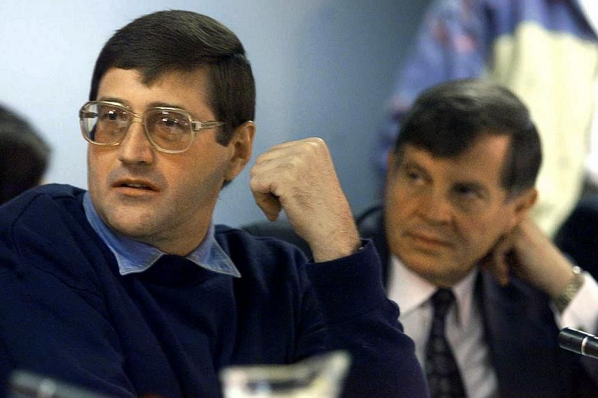 Apartheid death-squad leader Eugene de Kock (left) appears before the Truth And Reconciliation Commission (TRC) amnesty hearing with his lawyer Schalk Hugo in Pretoria in this May 24, 1999 file photo.&nbsp;-- PHOTO: REUTERS
