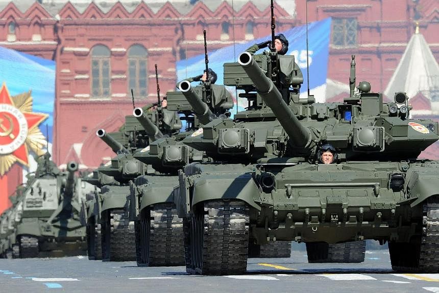 A file photo taken on May 9, 2013, shows a column of Russia's T-90 tanks rolling at the Red Square in Moscow, during Victory Day parade. The chief of Russia's armed forces said on Friday a strong nuclear arsenal will ensure military superiority over 