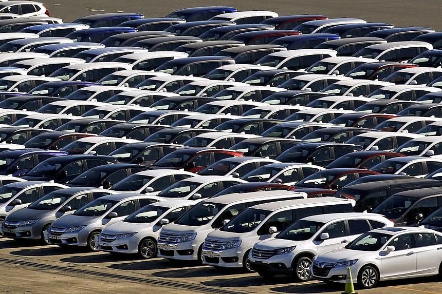 Honda cars awaiting export at port in Yokohama, south of Tokyo, on Dec 18, 2014. Japan's industrial production snapped two quarters of decline, signalling that the world's third-largest economy may have limped out of recession. -- PHOTO: REUTERS