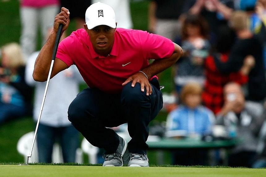 Tiger Woods assesses a putt on the 17th green during the first round of the Waste Management Phoenix Open at TPC Scottsdale on Jan 29, 2015, in Scottsdale, Arizona.&nbsp;While Tiger Woods struggled in his first PGA Tour start of the season, Ryan Palm