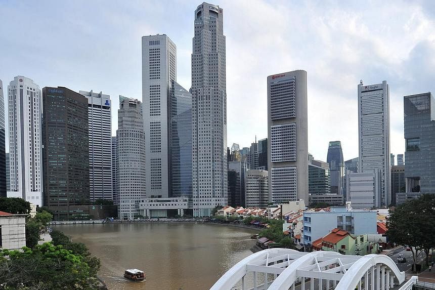 Singapore's Big Three local banks should be able to weather a significant rise in credit costs given their healthy loss-absorption buffers, says Fitch Ratings. -- PHOTO: ST FILE