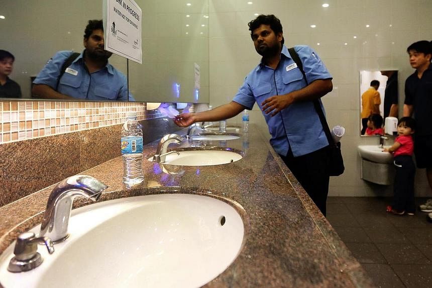 A toilet in Changi Airport's Terminal 3. There were signs reminding visitors not to drink the tap water. Cleaners also told visitors to drink the bottled water provided by the airport, which were placed by the sinks. -- PHOTO: LIANHE ZAOBAO