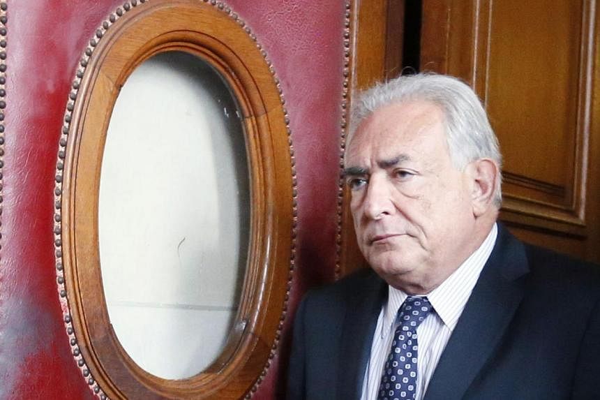 Dominique Strauss-Kahn was charged with "aggravated pimping in an organised group" after his name came up as part of an investigation into a prostitution ring in northern France and Belgium. -- PHOTO: AFP