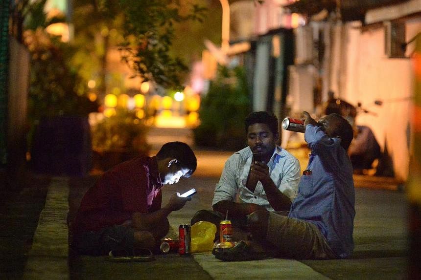 Foreign workers gather in twos and threes to drink beer in the quiet alleys of Geylang on a Sunday night on Jan 18, 2015.&nbsp;Mr Hri Kumar Nair (Bishan-Toa Payoh GRC), who chairs the Government Parliamentary Committee for Home Affairs and Law, said 