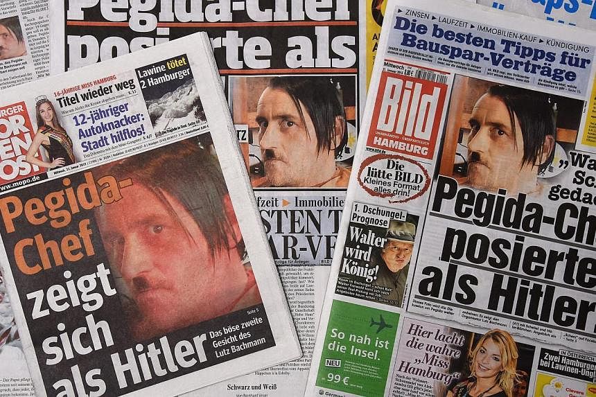 The front pages of German daily newspapers showing pictures of ex-Pegida head Lutz Bachmann sporting a "Hitler" moustache on Jan 21, 2015.&nbsp;The German anti-Islam group Pegida, whose rallies have brought up to 25,000 onto the streets of Dresden in