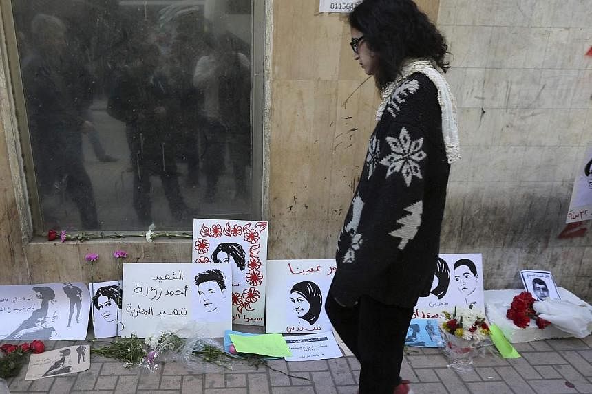 A woman looks at mementos left at the spot where activist Shaimaa Sabbagh died during a protest on Saturday, in central Cairo Jan 29, 2015.&nbsp;Tensions have been raised across Egypt this week by protests, some of them violent, marking the anniversa