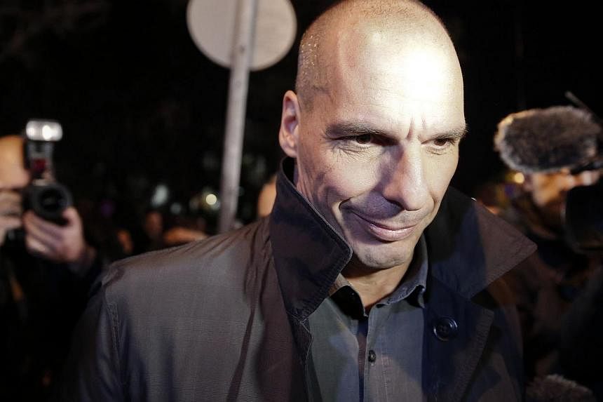 Greece's new left-wing Finance Minister Yanis Varoufakis (above) will visit three European Union capitals next week to push the government's agenda for a renegotiated deal on its multi-billion-euro bailout, his office said Thursday. -- PHOTO: REUTERS