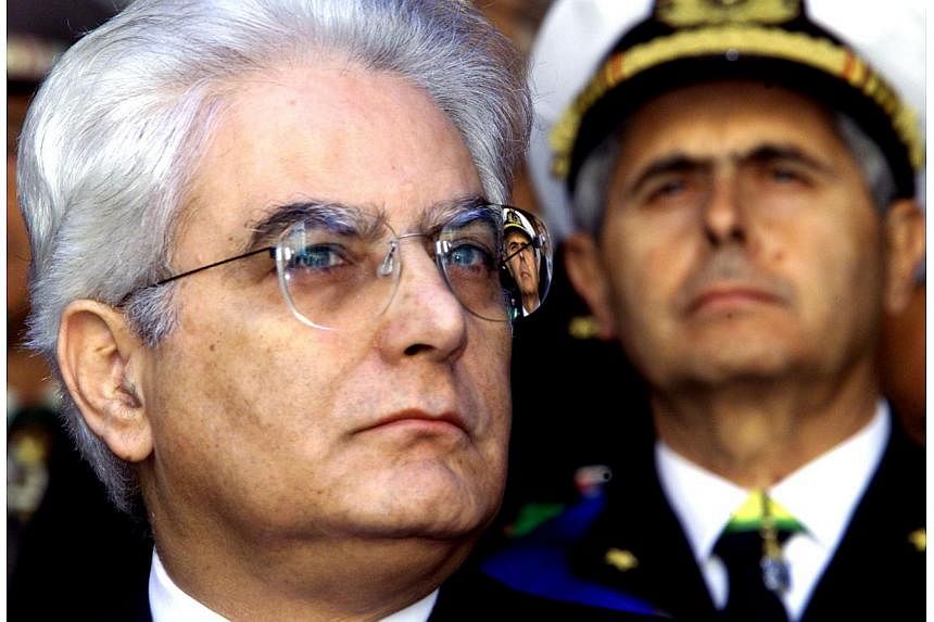 An undated picture made available on Jan 29, 2015 of Sergio Mattarella (left) at an undisclosed location. Italian lawmakers elected Sergio Mattarella, a constitutional court judge and veteran centre-left politician, as president on Saturday, handing 