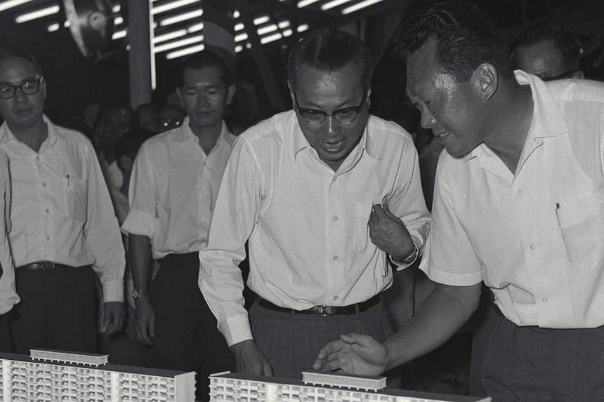 Then prime minister Lee Kuan Yew and Mr Lim Kim San in 1963 viewing models of the upcoming Cantonment Road housing estate. National Development Minister Khaw Boon Wan on Saturday lauded HDB pioneers, such as Mr Lim, for laying the foundation for publ