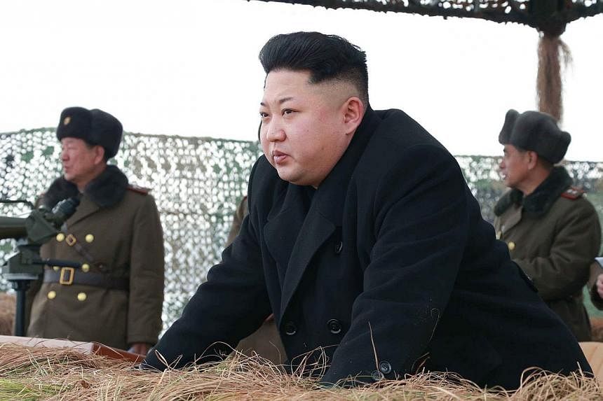 North Korean leader Kim Jong Un gives a field guide during a winter river-crossing attack drill of the armored infantry sub-units of the motorized strike group in the western sector of the front of the Korean People's Army (KPA) in this undated photo